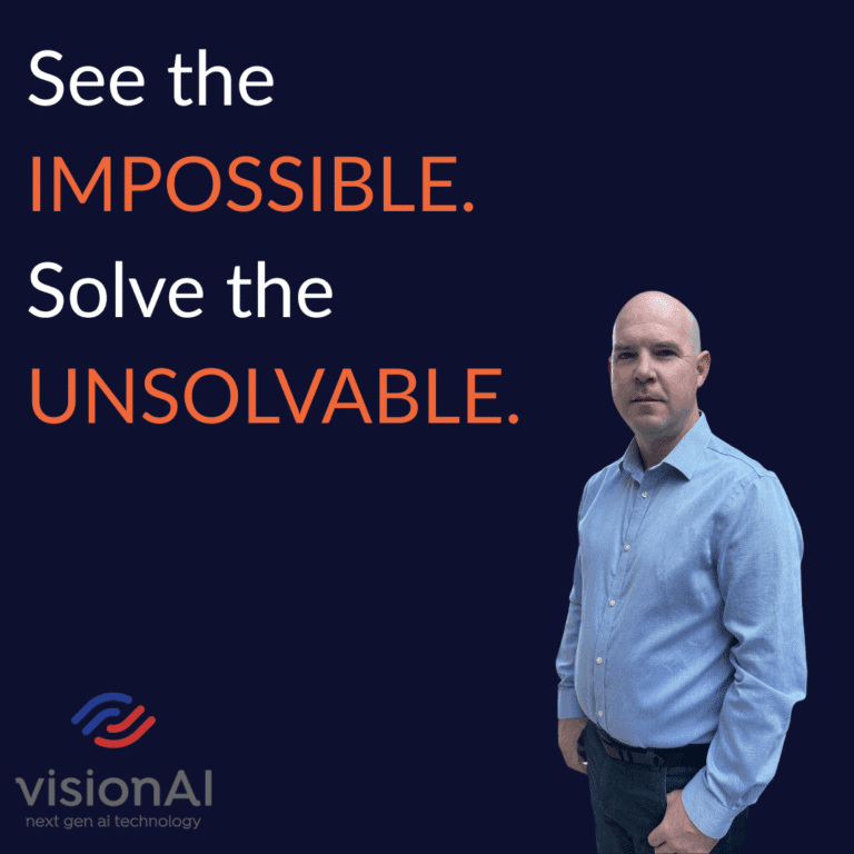Man in a blue shirt standing beside bold text that reads “See the IMPOSSIBLE. Solve the UNSOLVABLE.” with the visionAI logo below.