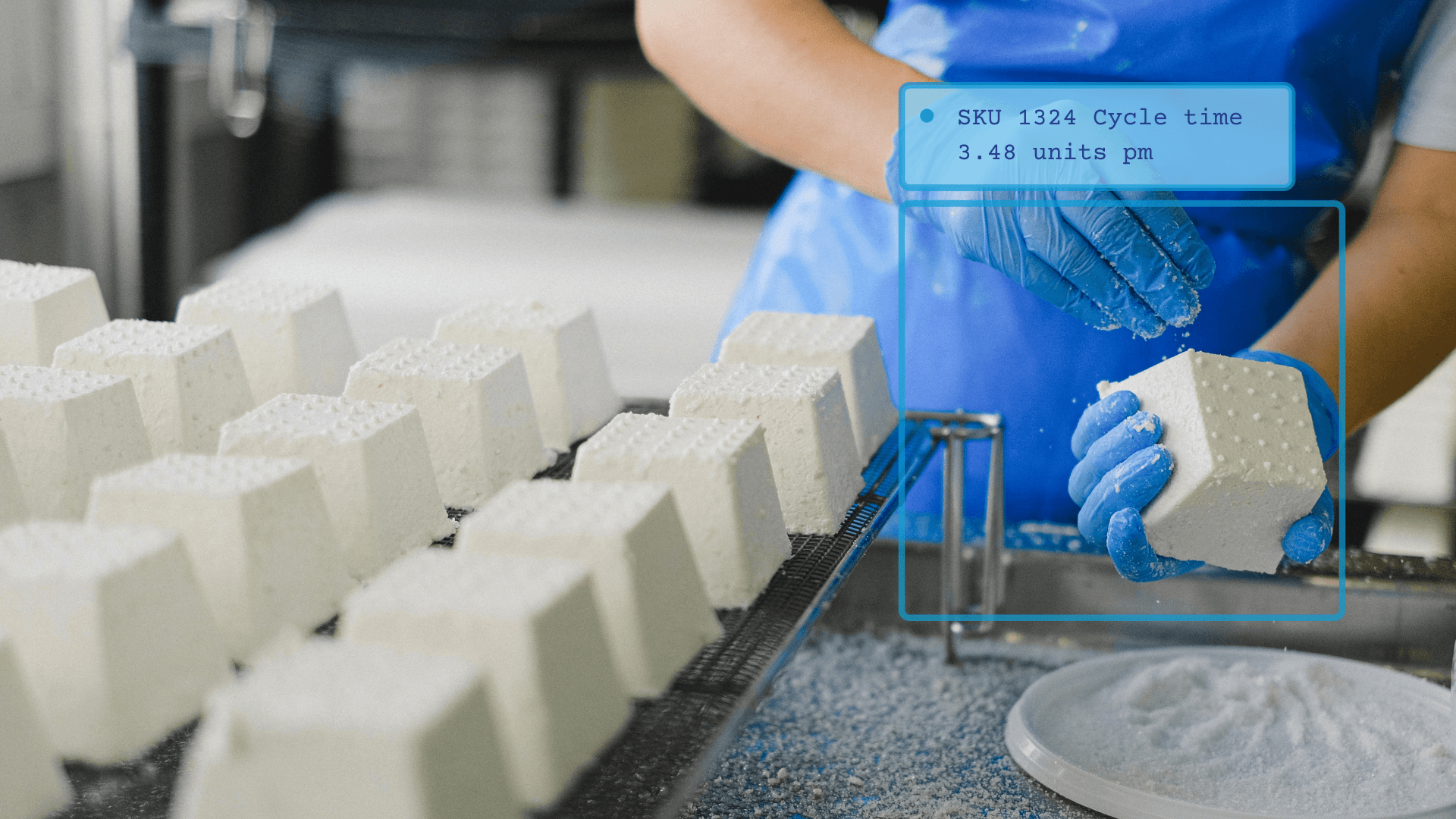 Operator measuring cycle time of products.