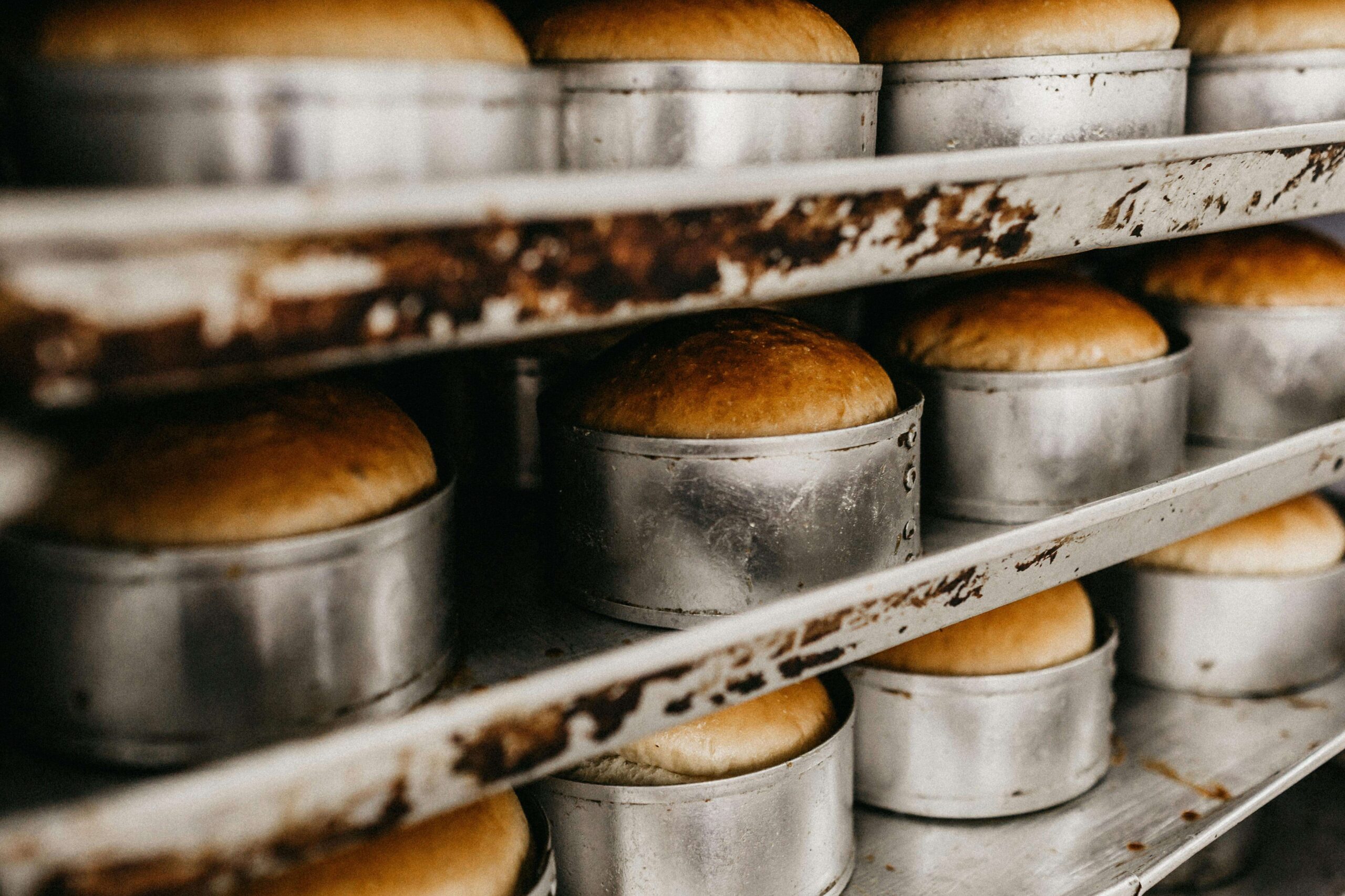 Freshly baked bread in metal pans