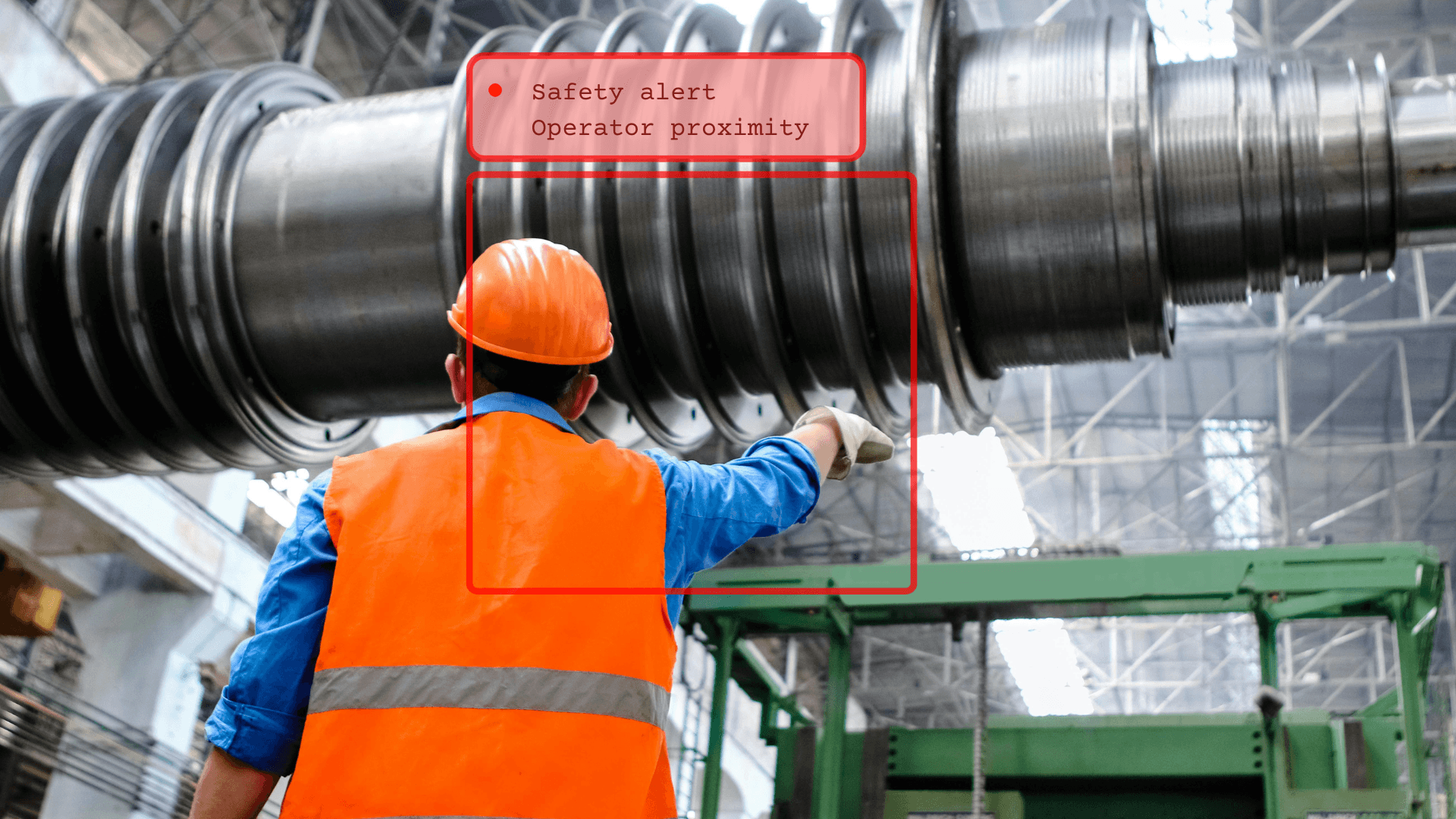 Worker near machinery with safety alert